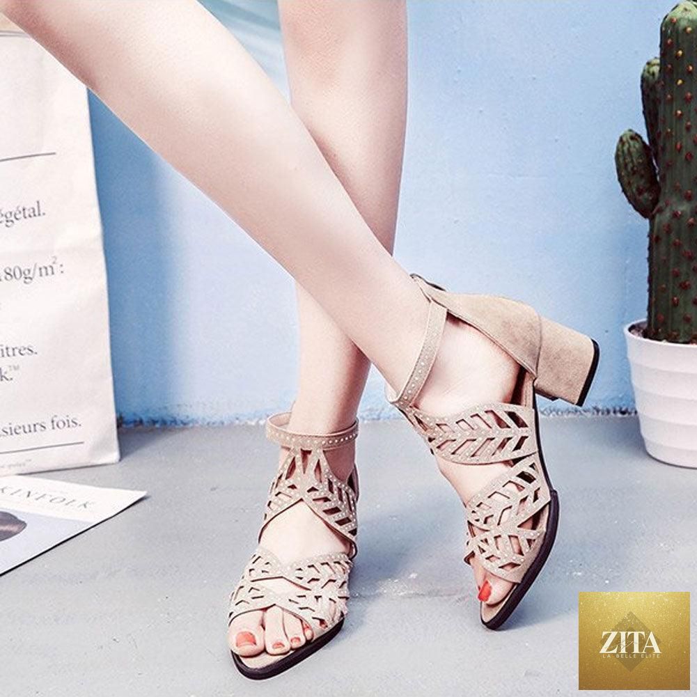 Black Stevvex women's summer sandals with hollow-out leather design, rhinestones, thick heel, zipper closure, and non-slip breathable sole.