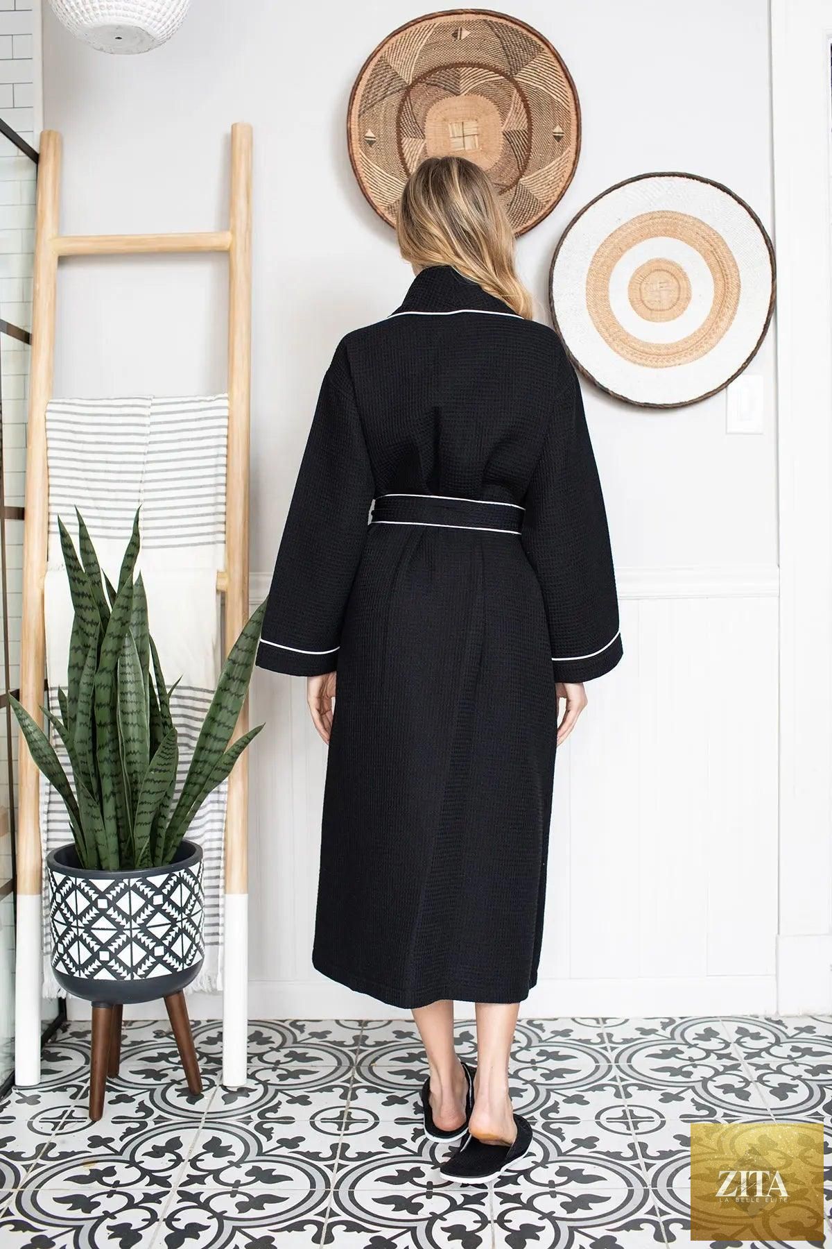 Black women's waffle piping bathrobe by Lotus Linen, lightweight spa-style robe with cozy, textured fabric for comfortable lounging.