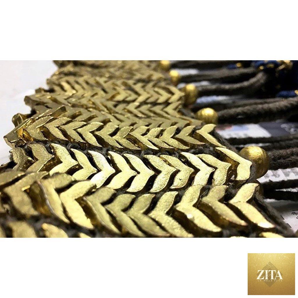 Boho tribal gold bib necklace with cotton tassels and zinc alloy details, featuring a statement design from BandsCo Straps.