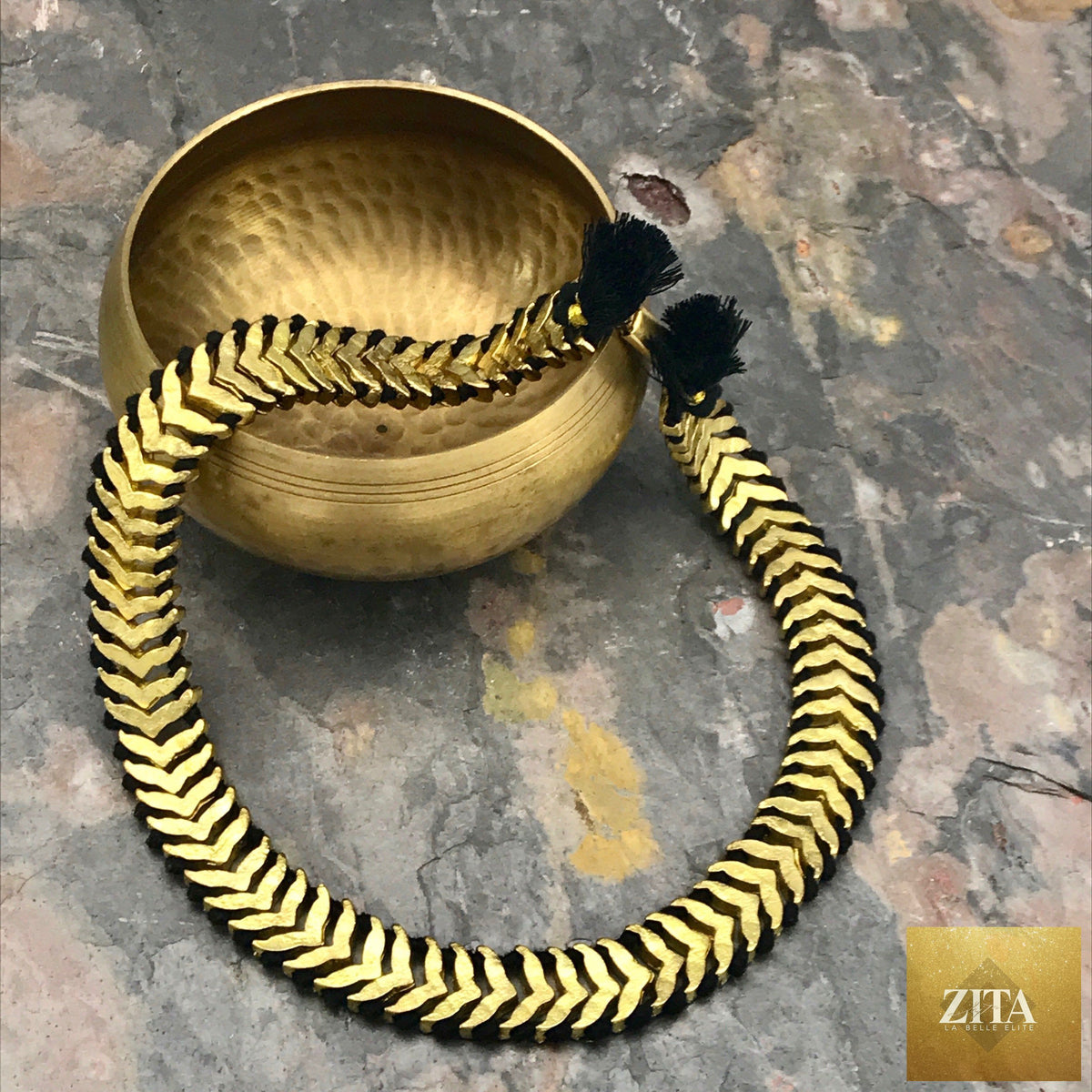 Boho tribal gold collar bib necklace with cotton tassels and zinc alloy details, handcrafted statement jewelry by BandsCo Straps.