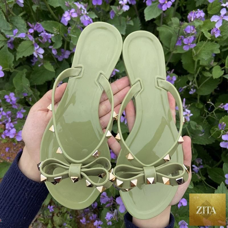 Stevvex bowknot summer beach flip flops for women, PVC slip-on flat sandals, featuring a cute bowknot design and comfortable flat sole.