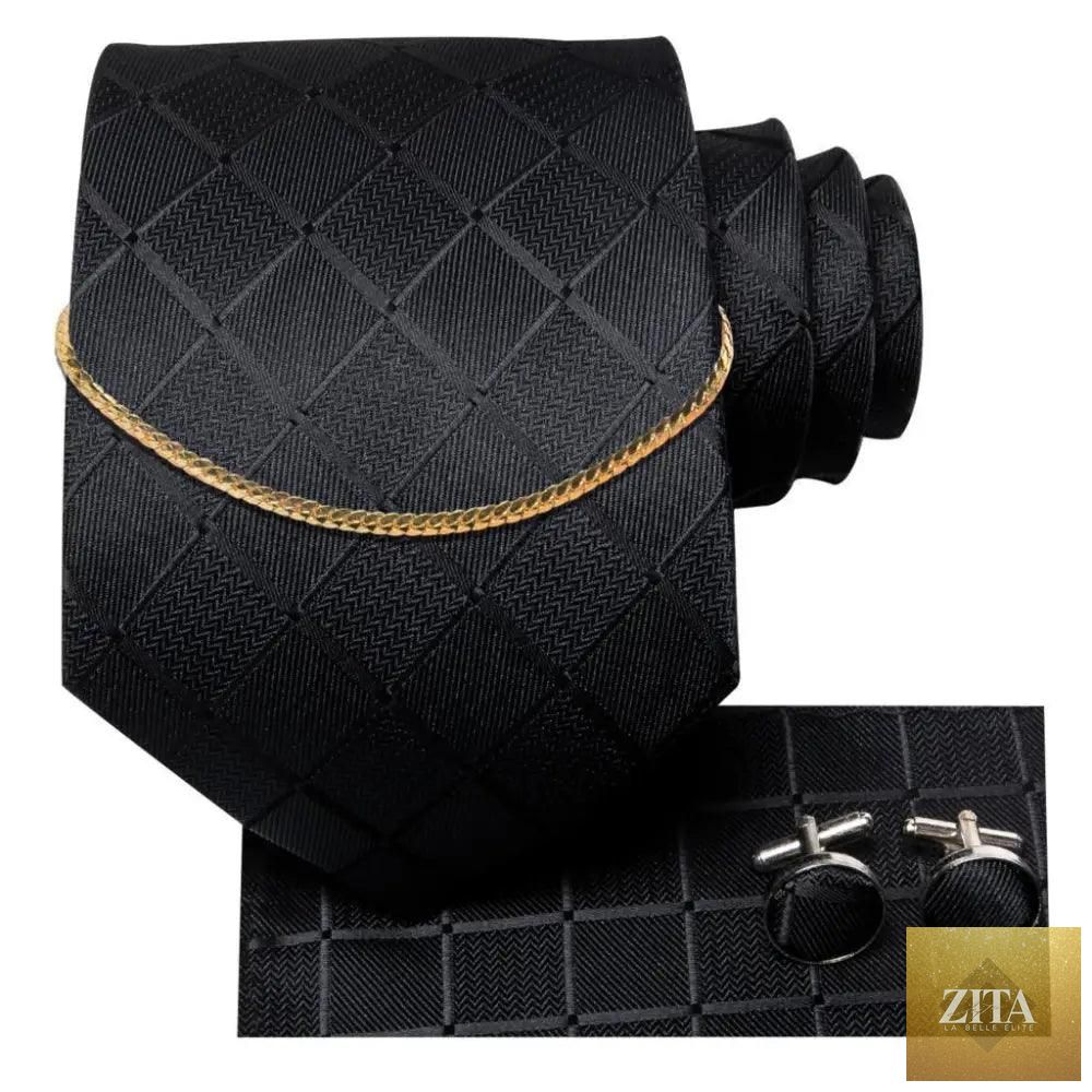 Elegant black silk necktie chain with matching square handkerchief and classic cufflinks, suitable for formal business and wedding attire.