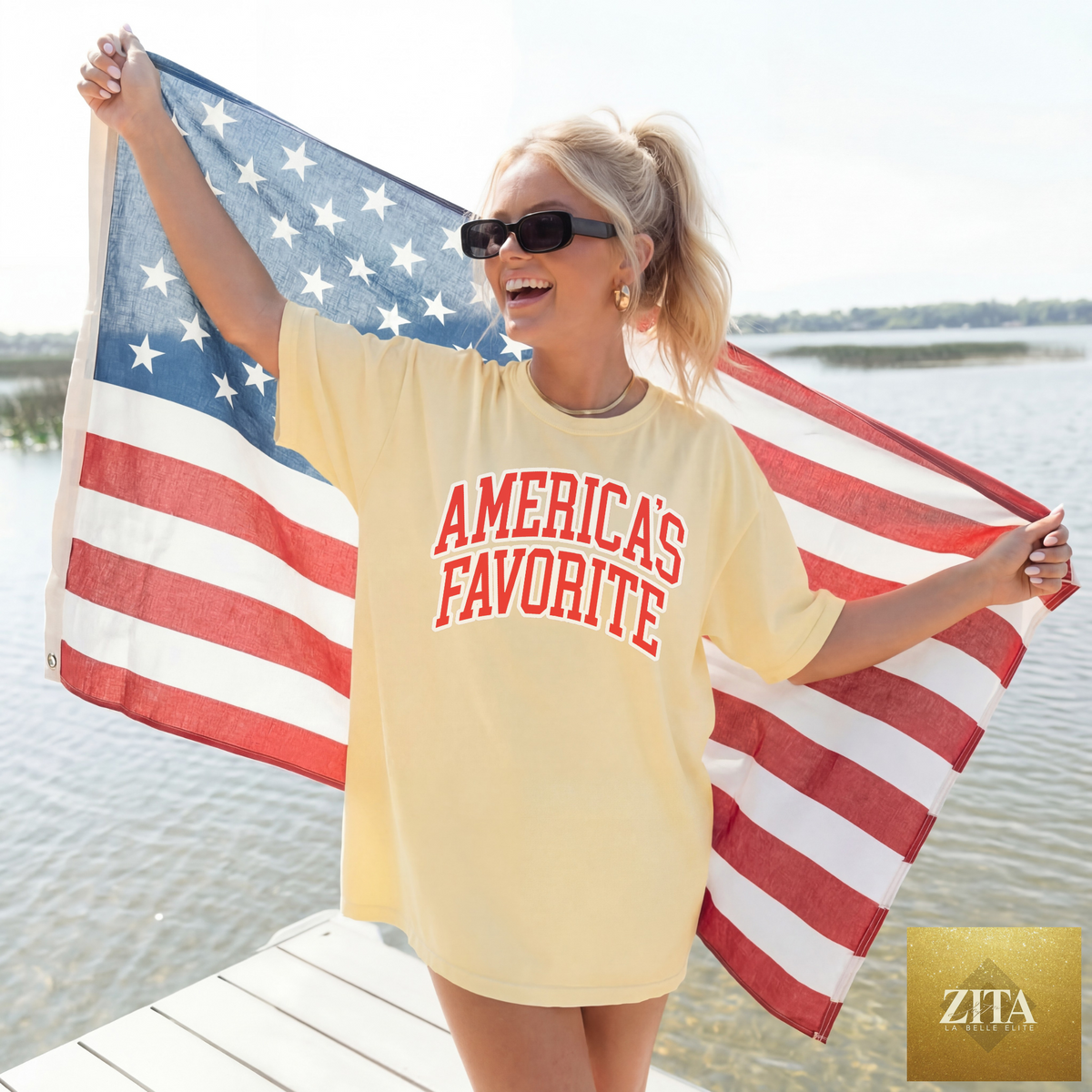 Red, white, and blue patriotic graphic tee by Hey Jude Graphic Tees featuring American flag and star designs on soft cotton fabric.