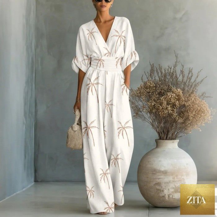 Women's waist-cinched V-neck printed wide-leg jumpsuit by Zita La Belle Elite, showcasing a casualwear style with a flattering fit.