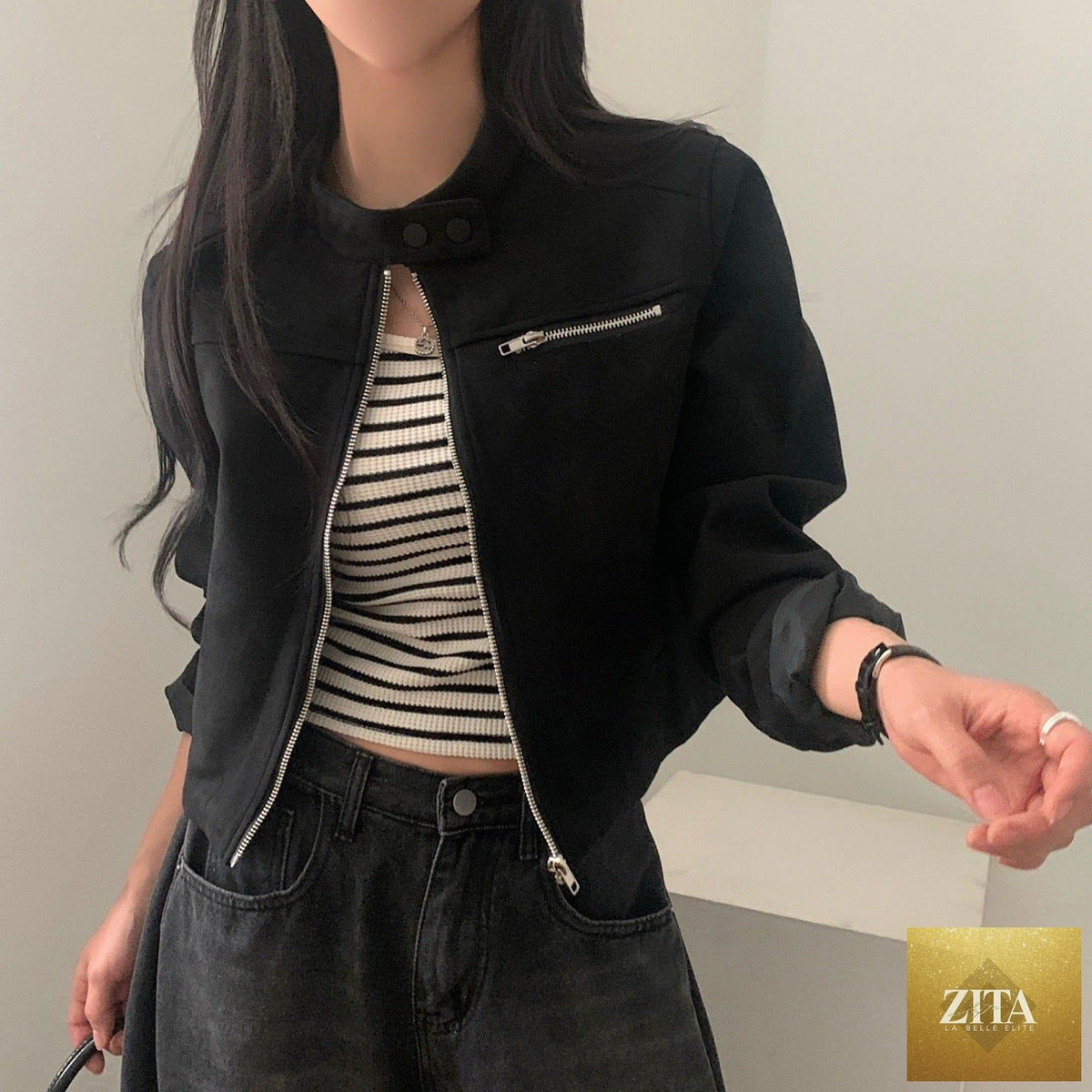 High waist suede motorcycle top jacket with short length and fitted design, featuring a lapel collar and zip closure.