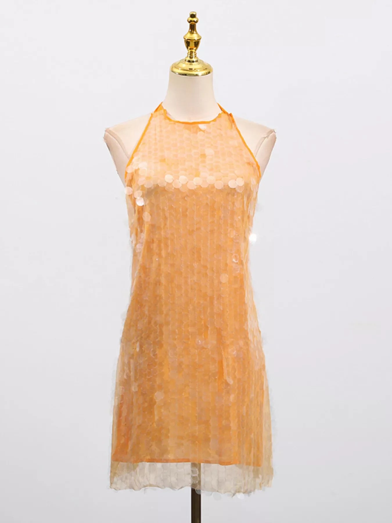 Sequin halter neck mini dress from Shopiebay featuring shimmering sequins and a fitted silhouette for a glamorous look.