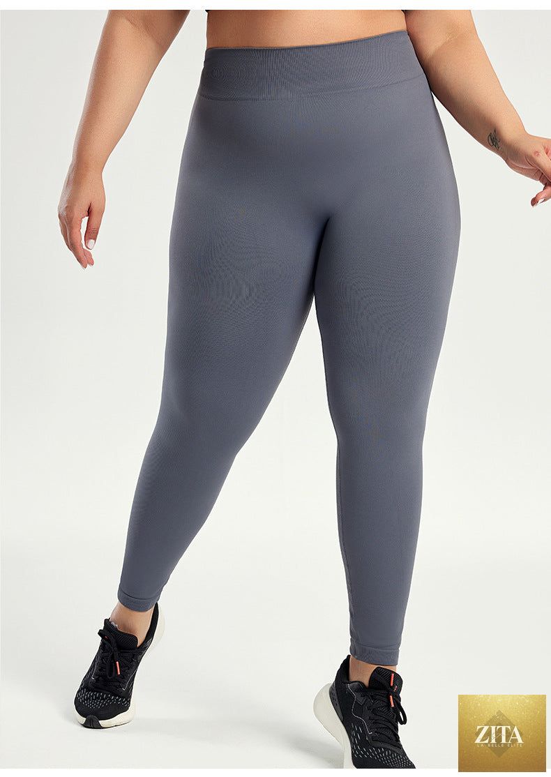 Plus-size women's yoga pants in extra-large size, black, fitted with elastic waist, comfortable for active wear.
