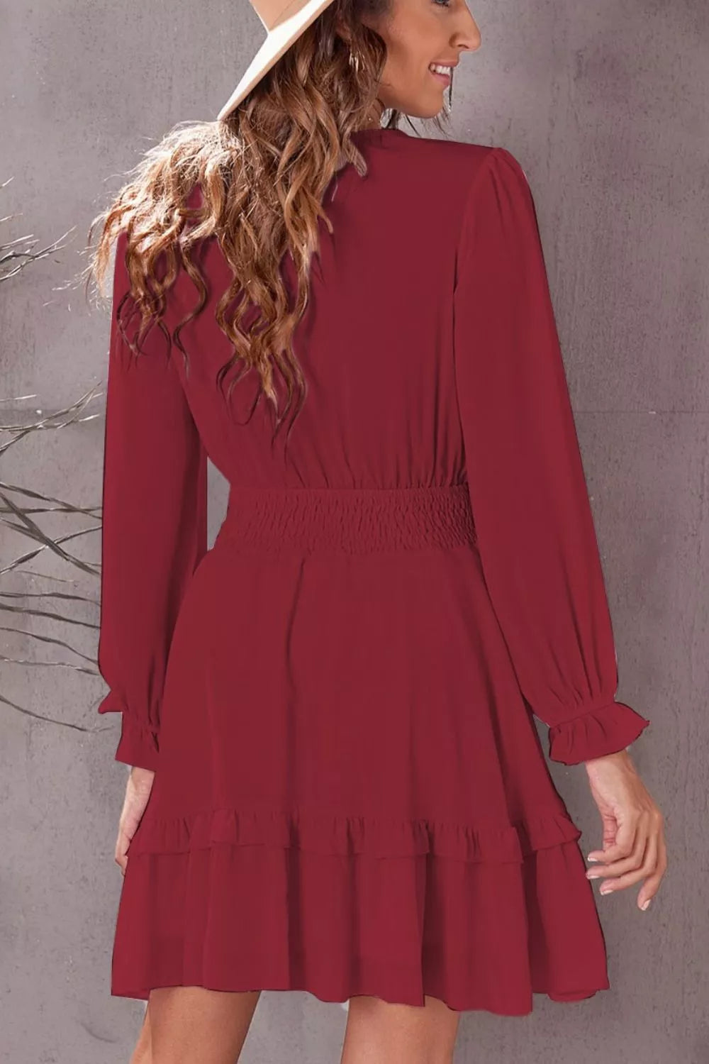 Elegant tie-front ruffle mini dress with smocked waist by Shopiebay, featuring flowy fabric and stylish design.