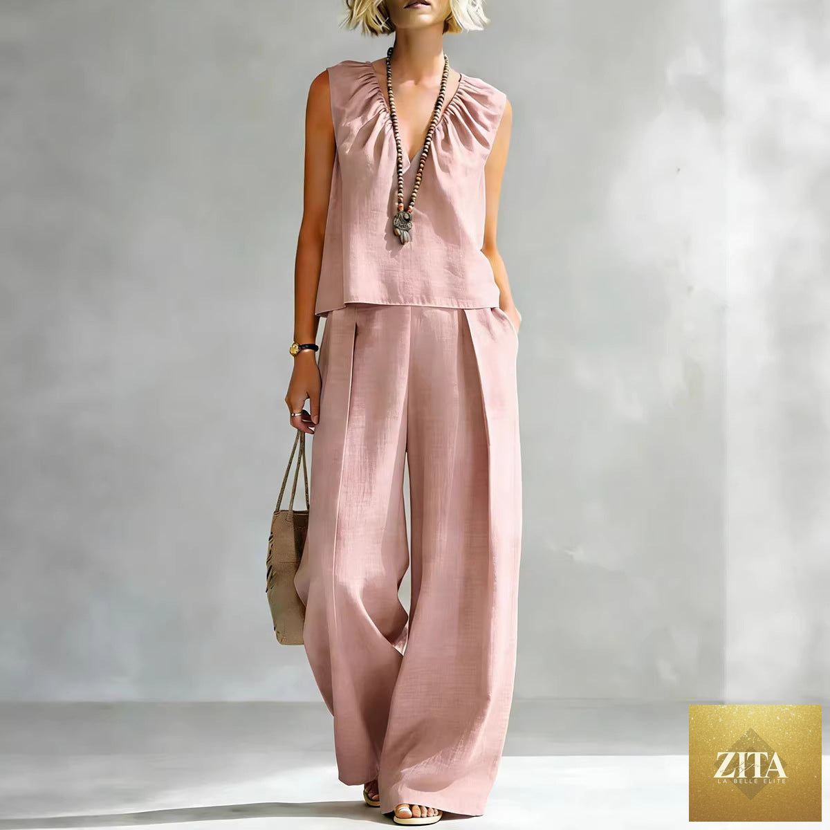 Women's sleeveless cotton-linen shirt and pants set from FitiqueFit, casualwear, featuring a relaxed fit and lightweight fabric.