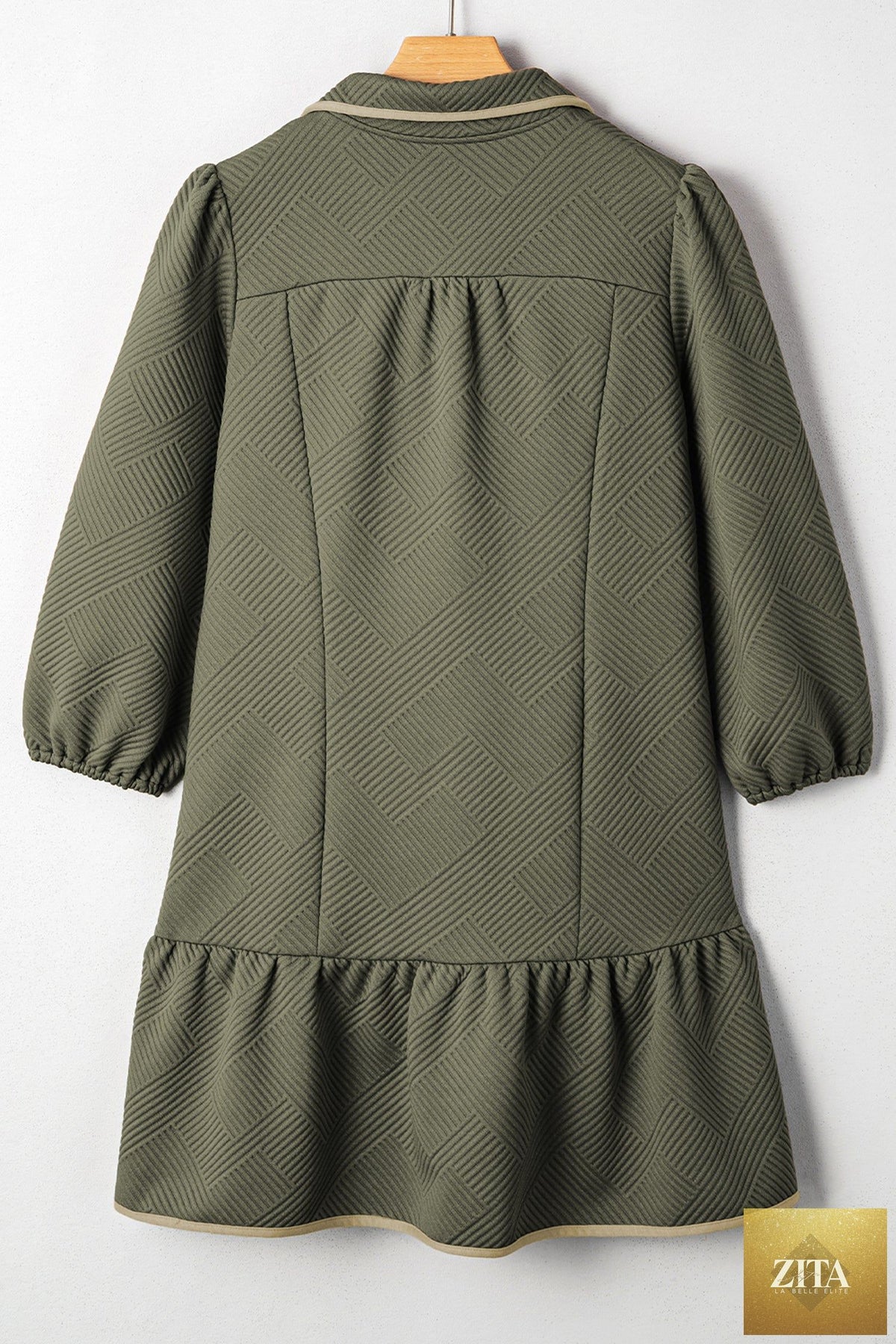 Jungle green plus size textured mini dress with contrast trim, quarter zip, bracelet sleeves, from Wild and Free Boutique.