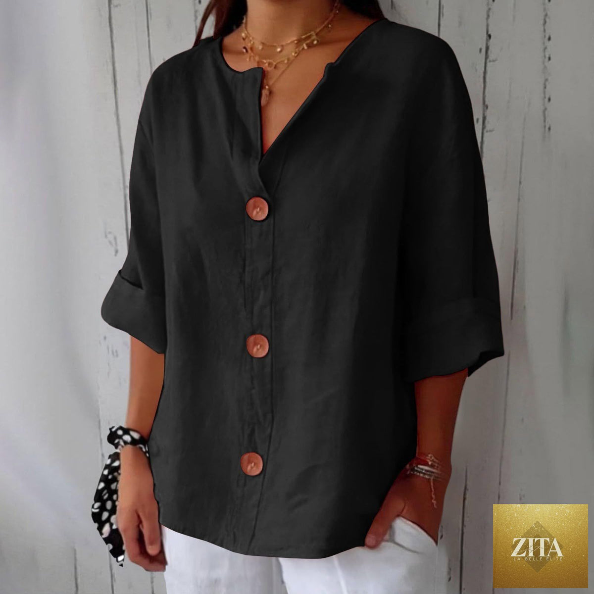Women's V-neck cotton linen blouse by FitiqueFit featuring button details and casual style, displayed on a hanger.