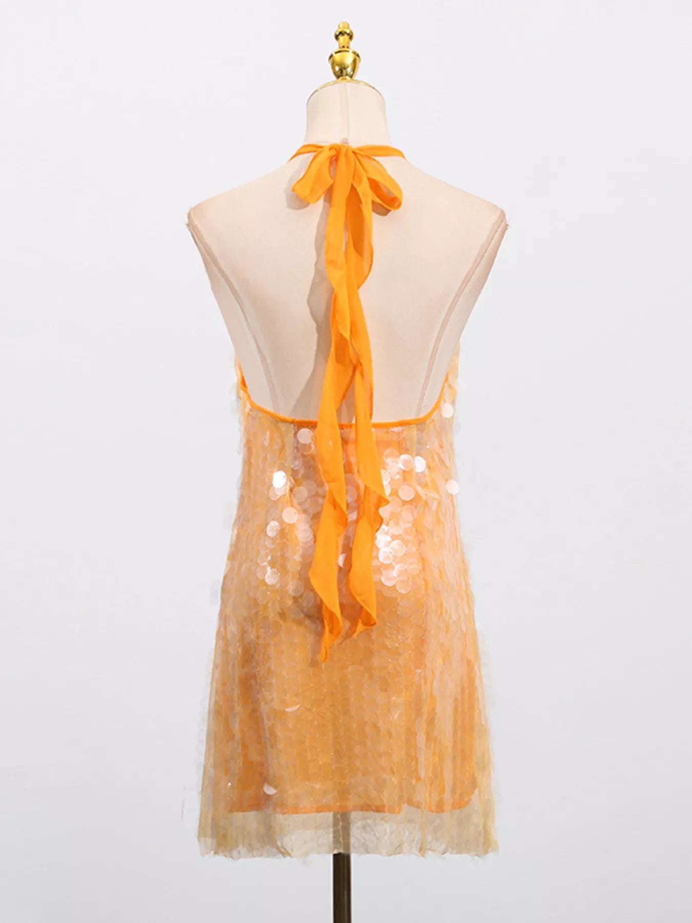 Sequin halter neck mini dress by Shopiebay featuring sparkling sequins and a stylish halter neckline, perfect for evening wear.