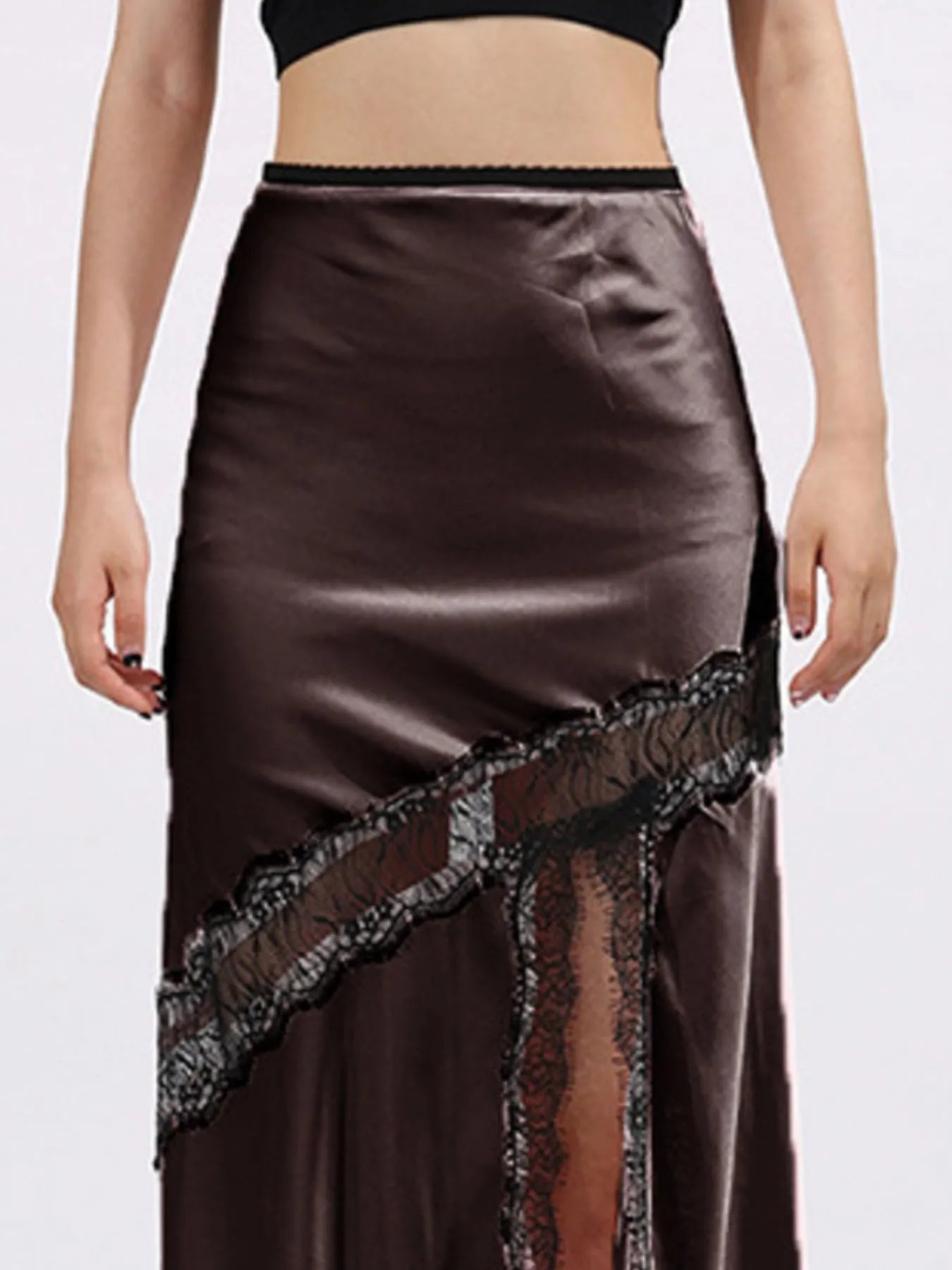 Lace trim asymmetrical midi skirt by The Fashion Celestial, featuring flowing fabric and stylish design, shown from the front.