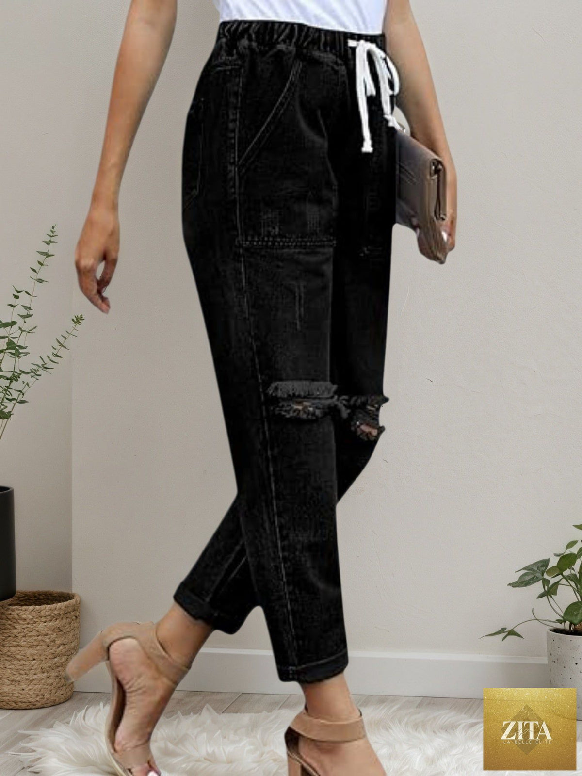 Women’s distressed stretch denim joggers with elastic waist, casual fit, from FitiqueFit, featuring a relaxed, trendy design.