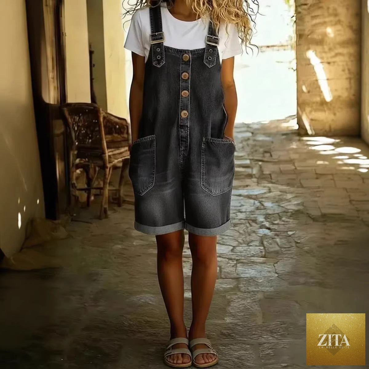 Women’s high-waisted sleeveless denim shorts jumpsuit by Zita La Belle Elite, casualwear, showing front view with pockets and belt loops.