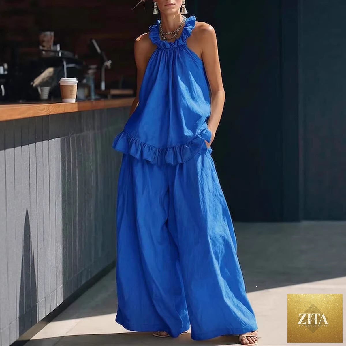 Zita La Belle Elite halterneck loose two-piece casualwear set with pleated fabric and asymmetric pockets on top and pants.