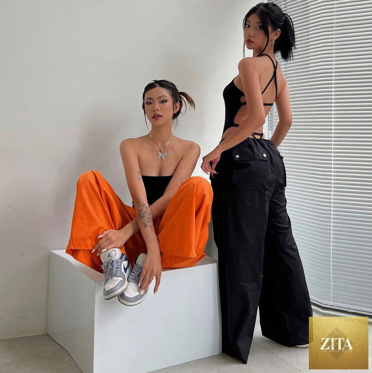 Women’s high-waist lace-up straight-leg cargo pants by Zita La Belle Elite, loose fit casualwear with pockets and lace-up details.