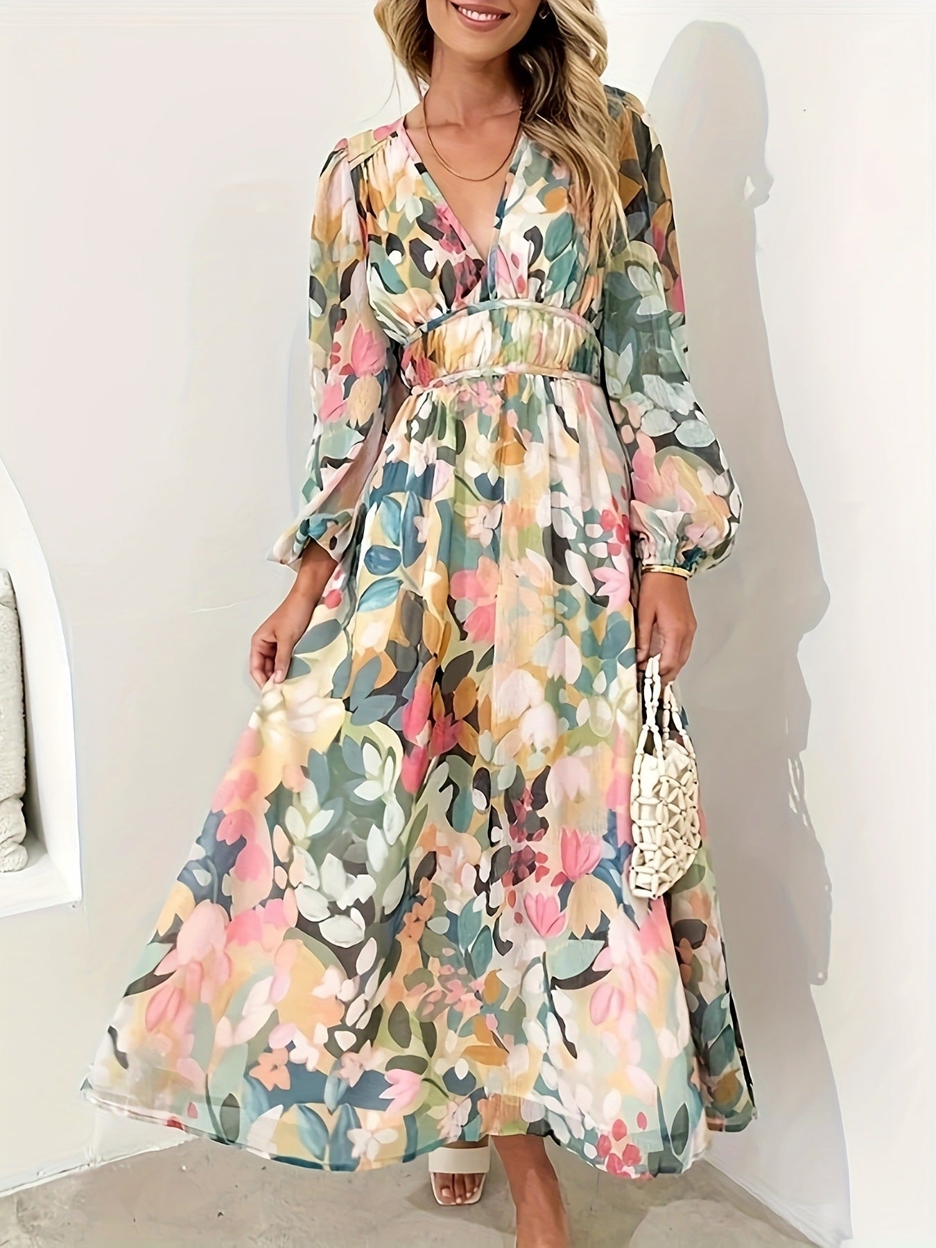 Floral print long sleeve midi dress by Shopiebay featuring a feminine design and flowing fabric, shown on a model.