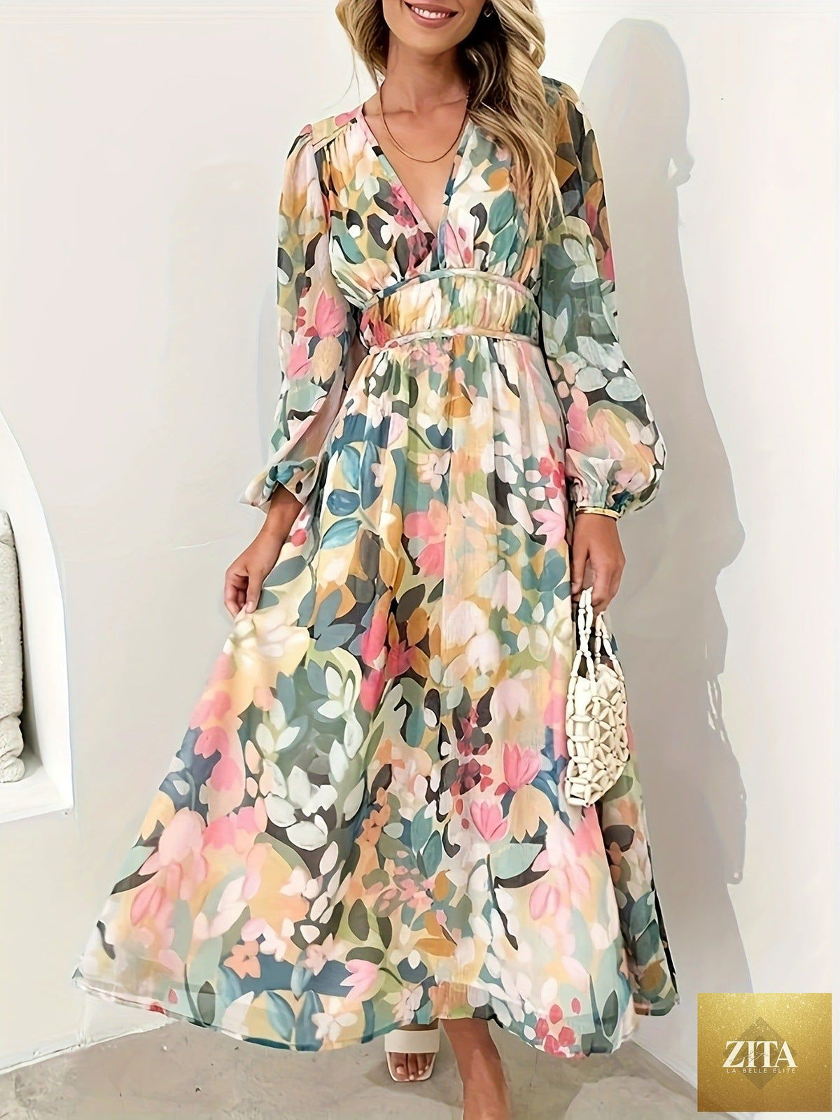 Floral print long sleeve midi dress by Shopiebay featuring a feminine design and flowing fabric, shown on a model.