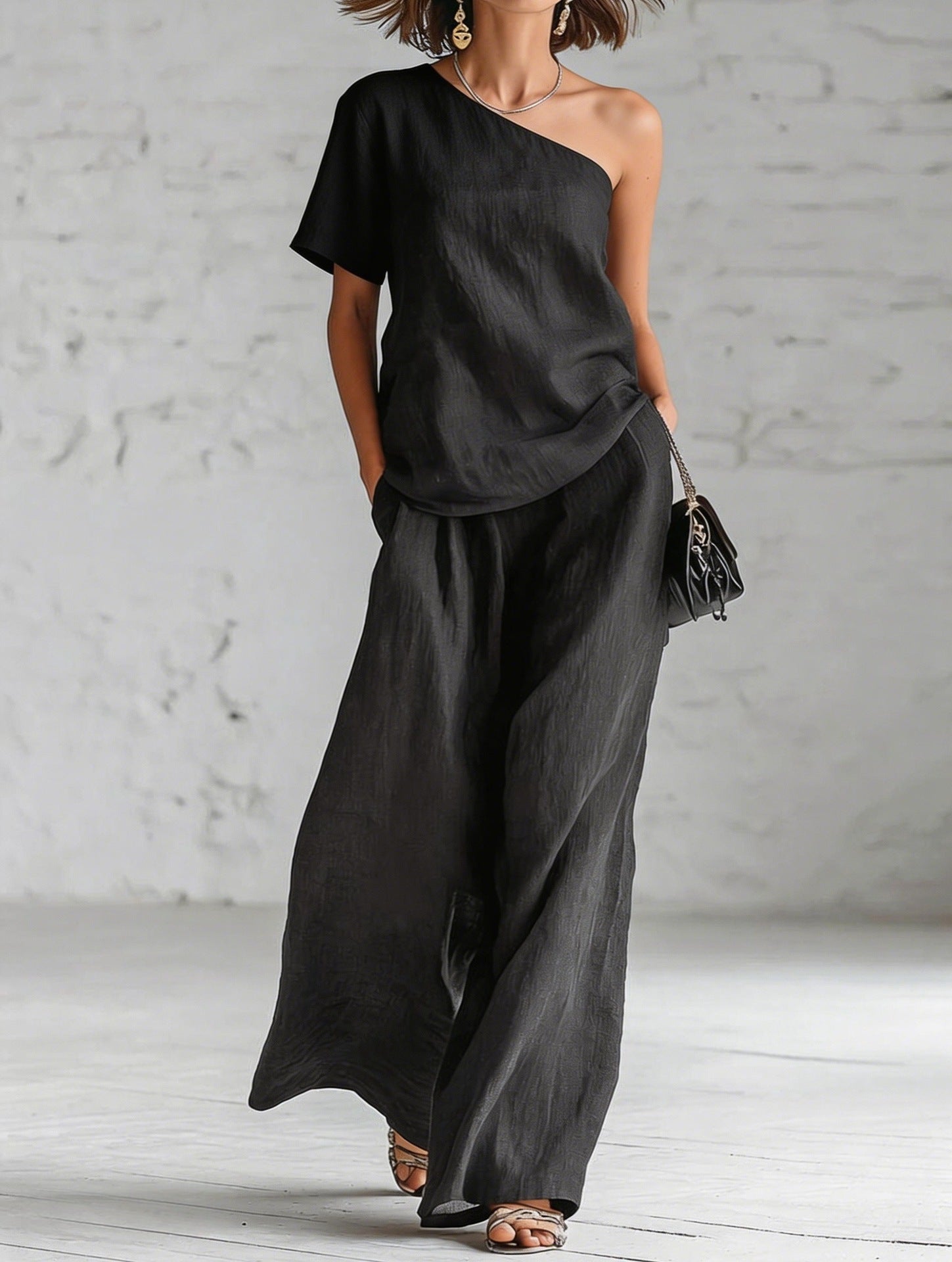 Women's wide-leg pants and top set in casualwear by FitiqueFit, featuring a stylish three-quarter sleeve design.