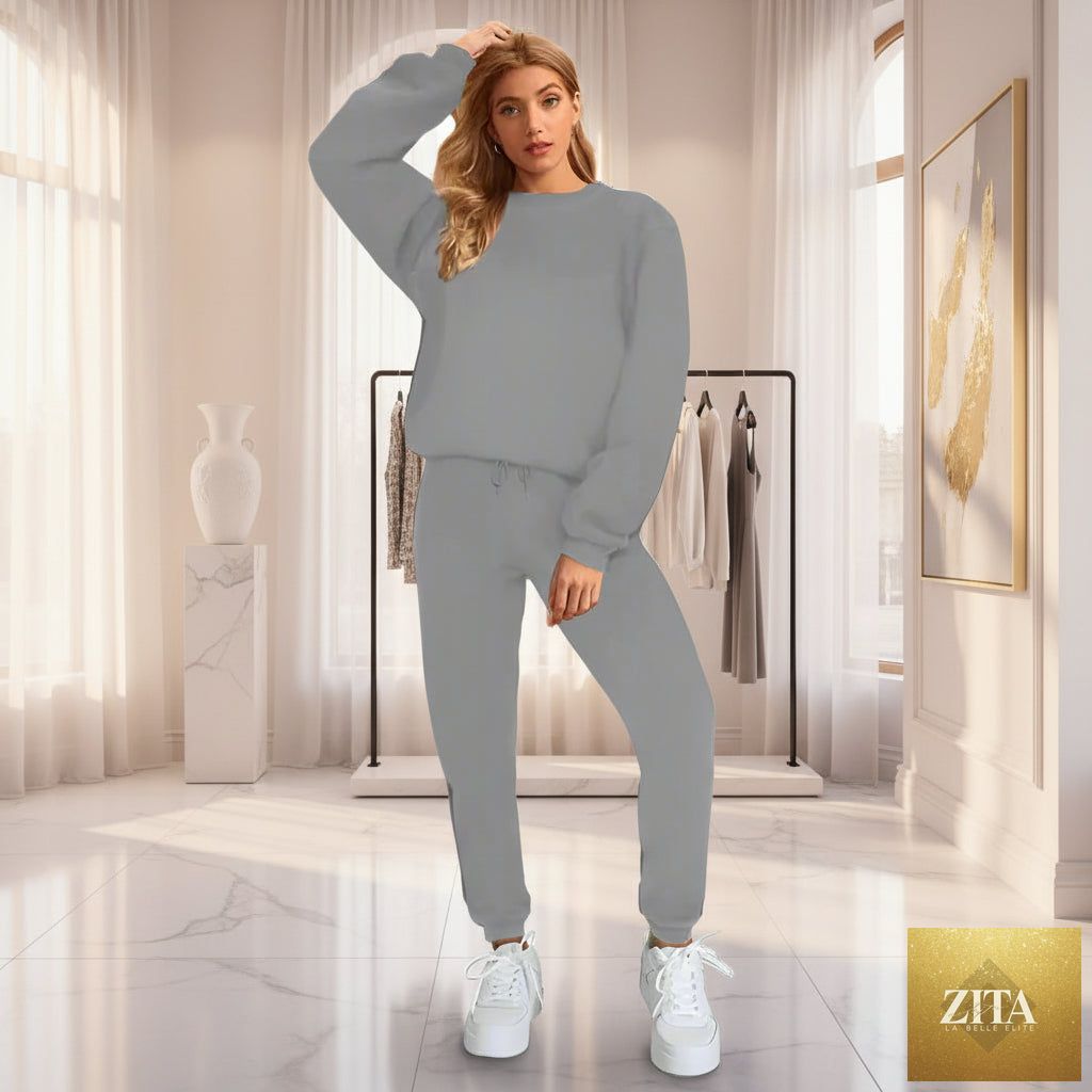 Women's oversized drop-shoulder sweatshirt and jogger pants sweatsuit set by MERIDGE, casual two-piece athleisure outfit.
