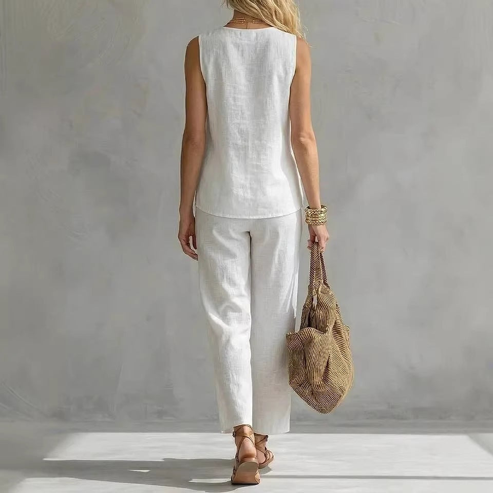 Women's sleeveless V-neck top and full-length pants casual wear two-piece set by FitiqueFit, shown in a relaxed fit and neutral color.