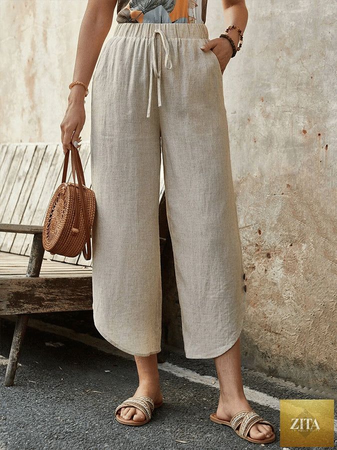 Women's cotton-linen cropped drawstring pants by FitiqueFit, casualwear with a relaxed fit and adjustable waist, shown in natural fabric.