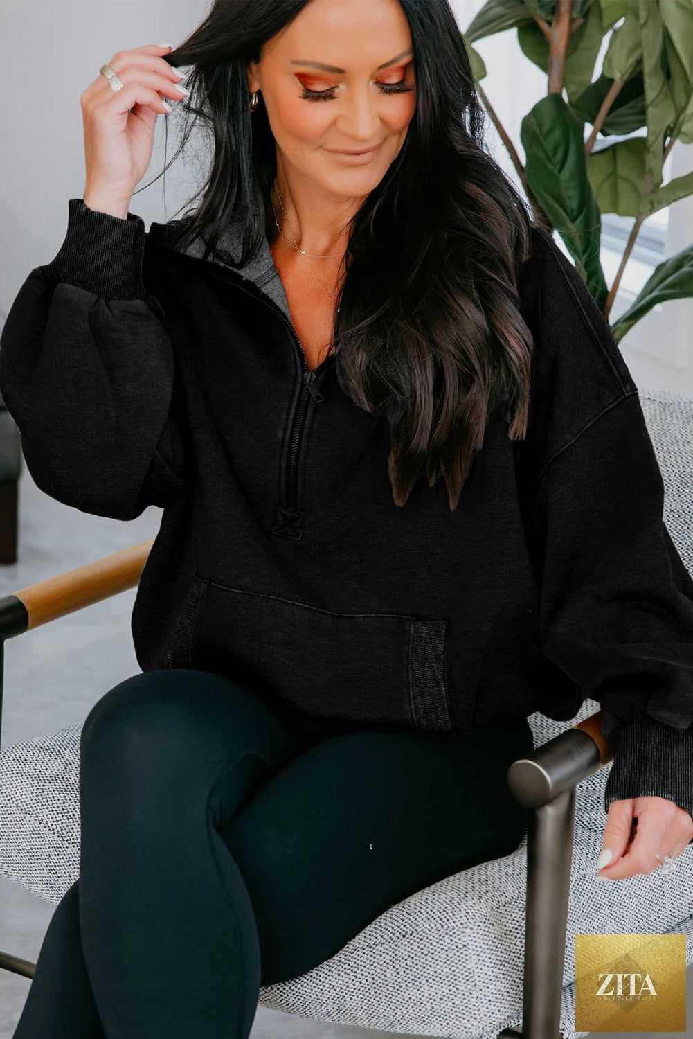 Black half zip kangaroo pocket hoodie from Wild and Free Boutique, mineral wash, baggy fit, casual sweatshirt with hood.