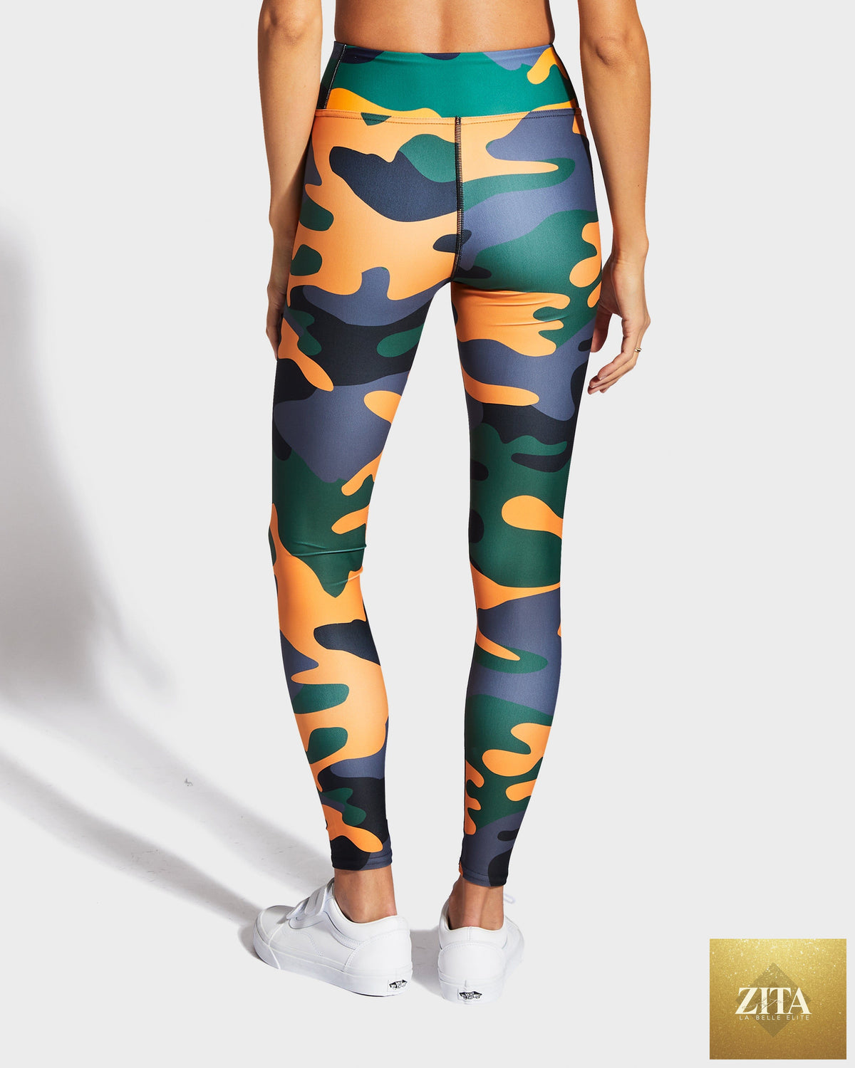 Ruffhaus NYC camo orange yoga leggings featuring a bold camouflage pattern and comfortable fit for active wear.