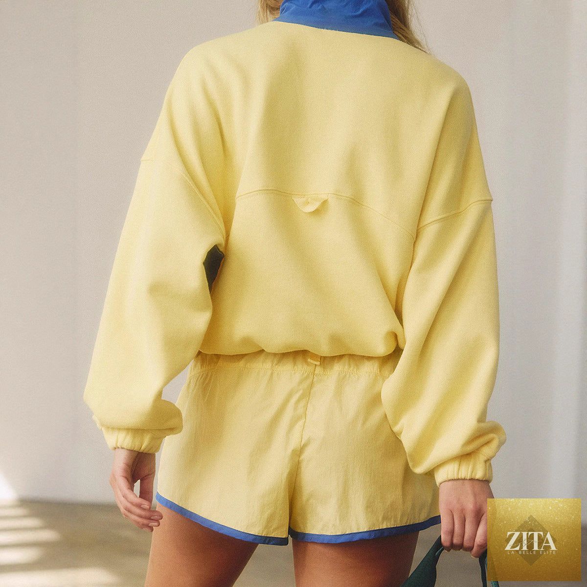 Women's long-sleeve contrast color 2-piece casualwear set with top and cropped pants by FitiqueFit, shown in stylish outfit.