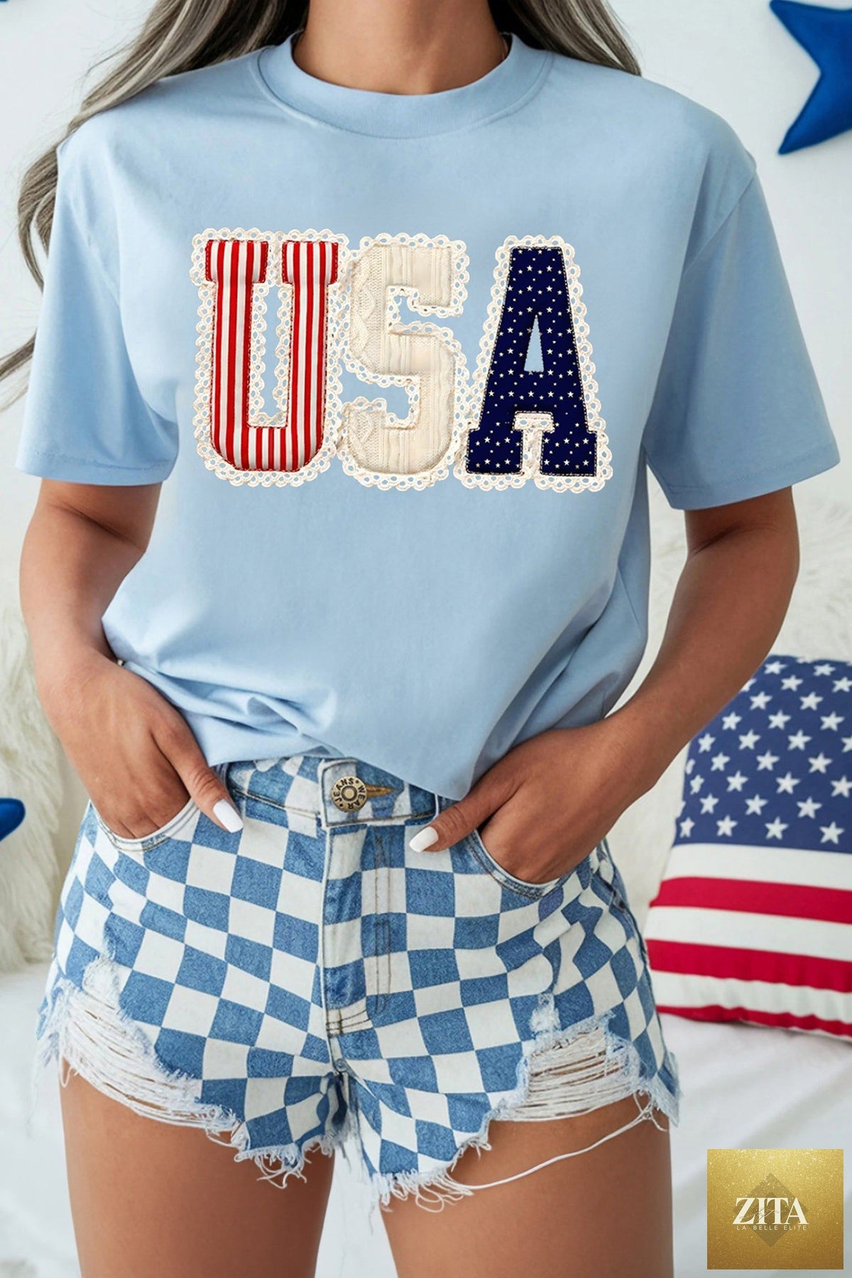 Light blue USA patriotic printed graphic T-shirt from Wild and Free Boutique featuring stars and flag design.