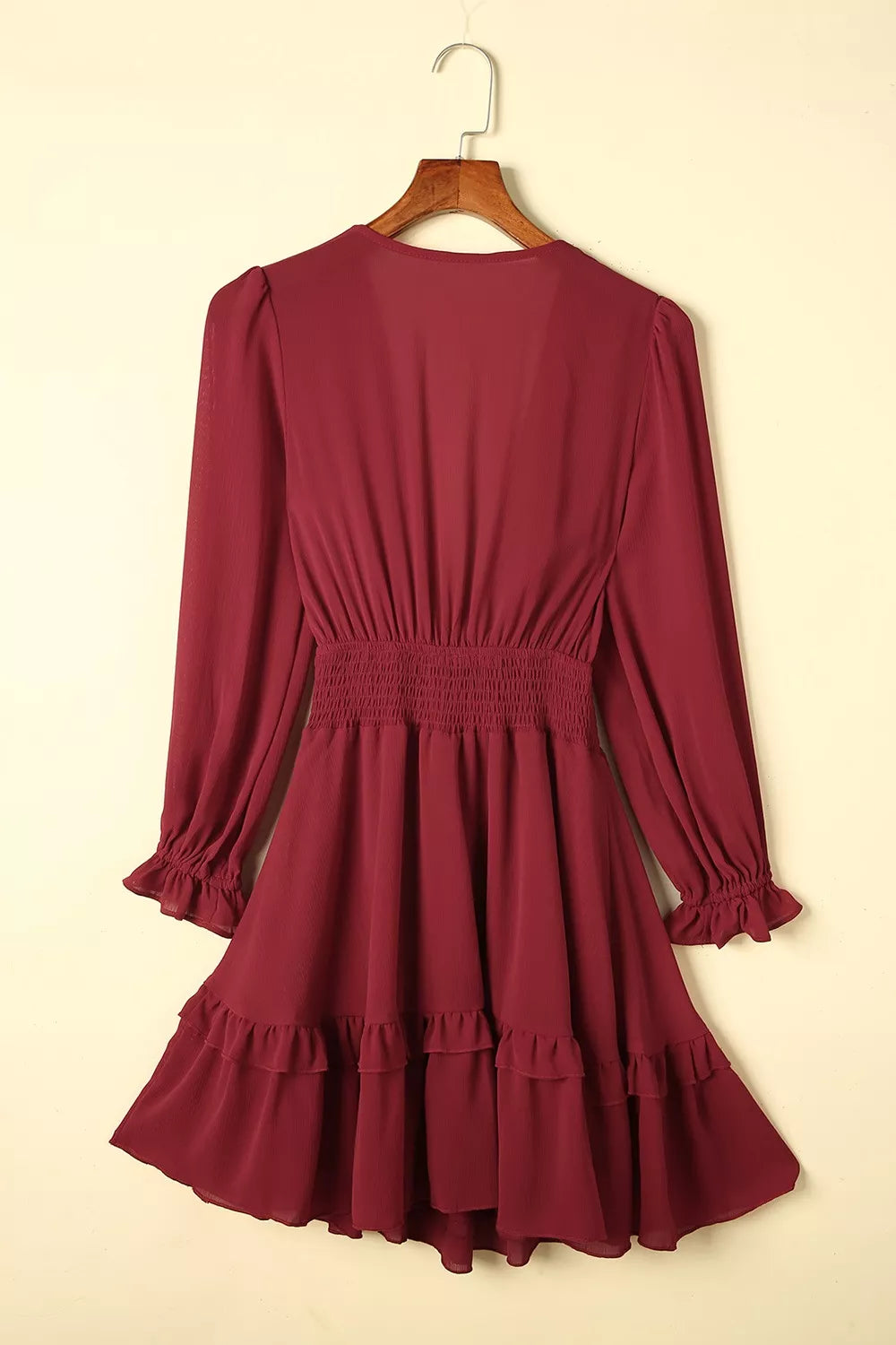 Elegant tie-front ruffle mini dress with smocked waist from Shopiebay, featuring floral fabric and stylish design.