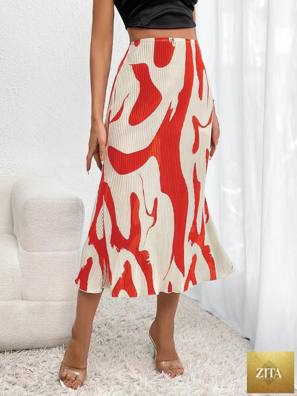 Women's zebra print pleated casual skirt with irregular hem and side slit, by Zita La Belle Elite, shown on a model.