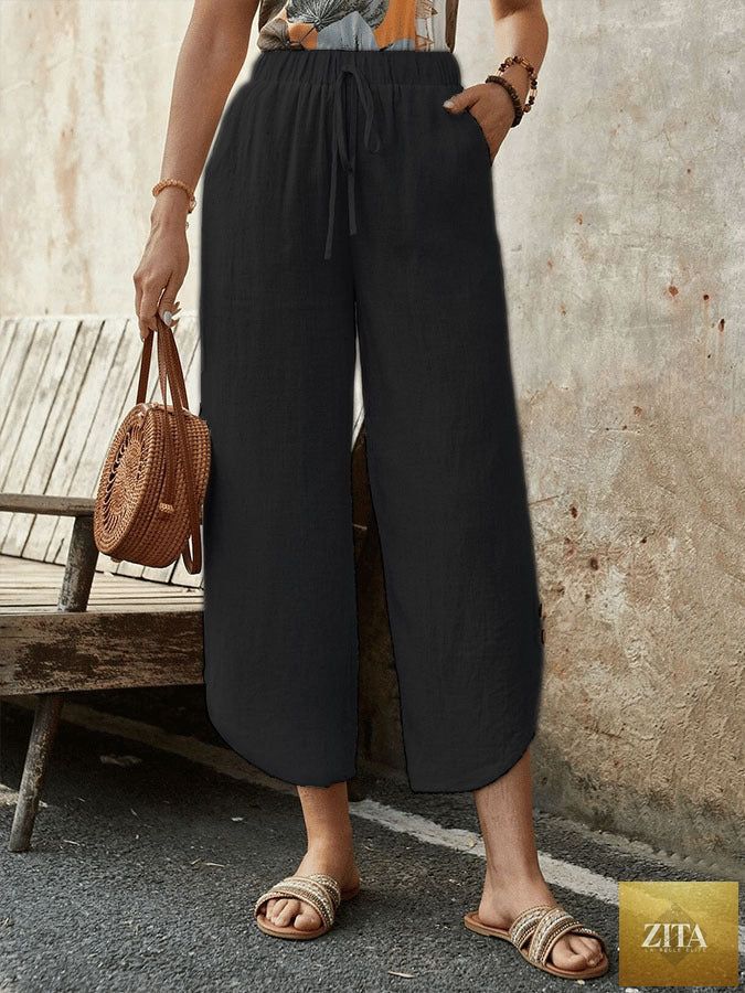 Women's cotton-linen cropped drawstring pants by FitiqueFit, casualwear with a relaxed fit and adjustable waistband.