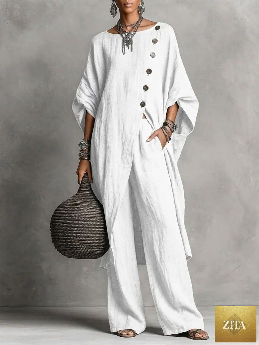 Women's casualwear set by Zita La Belle Elite featuring a drop shoulder three-quarter sleeve irregular shirt and matching pants.