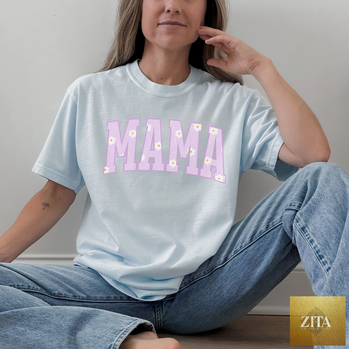 Hey Jude Graphic Tees MAMA Daisy graphic T-shirt in chambray fabric, featuring a playful daisy design on the front.
