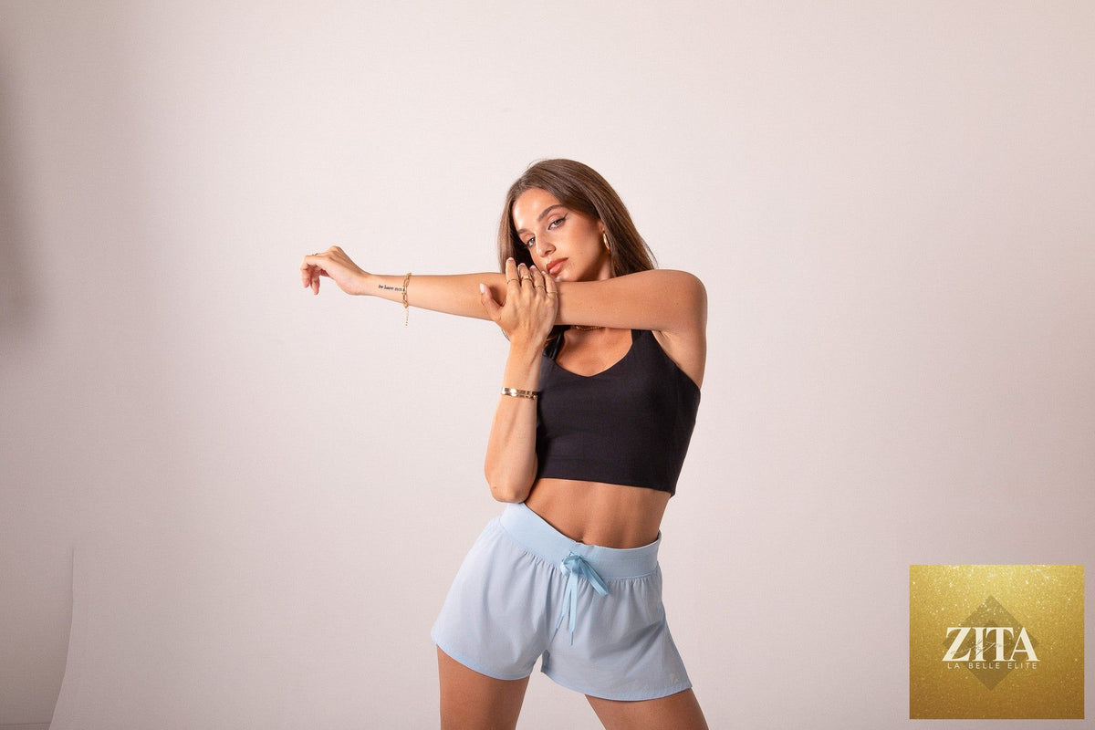 Baby blue Cheeky Flyaway Shorts by Runner's Athletics, designed for women's running and workout activities.