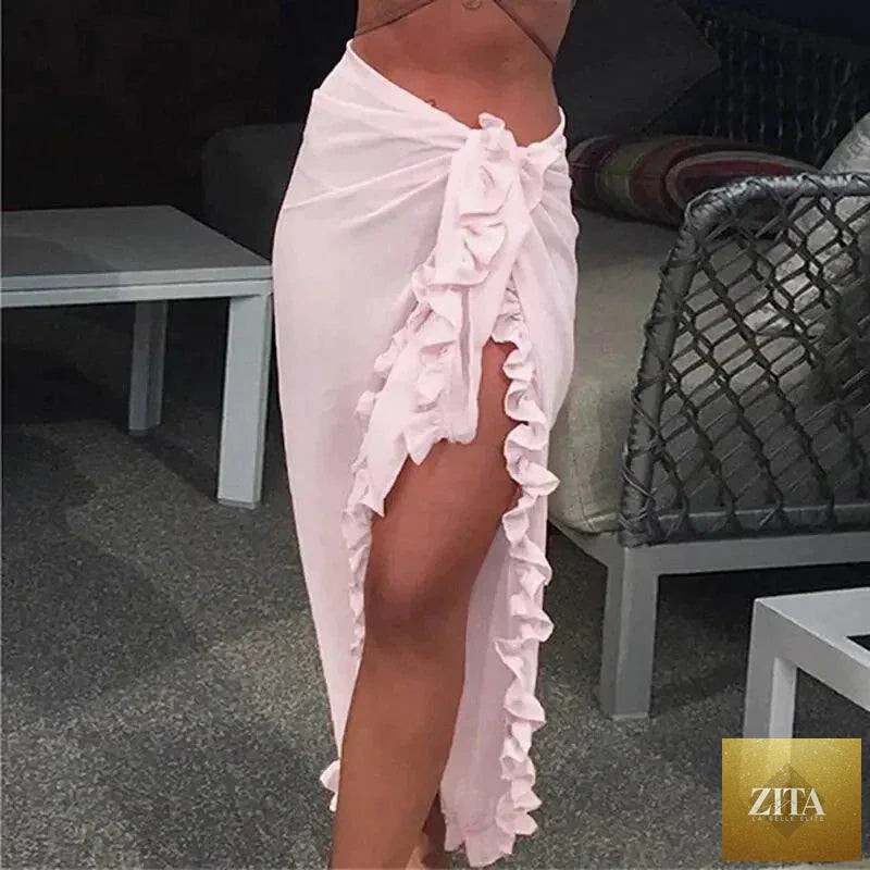 Mandotos GlamourWave chiffon beach wrap draped over a model, lightweight and elegant for sunny beach days.