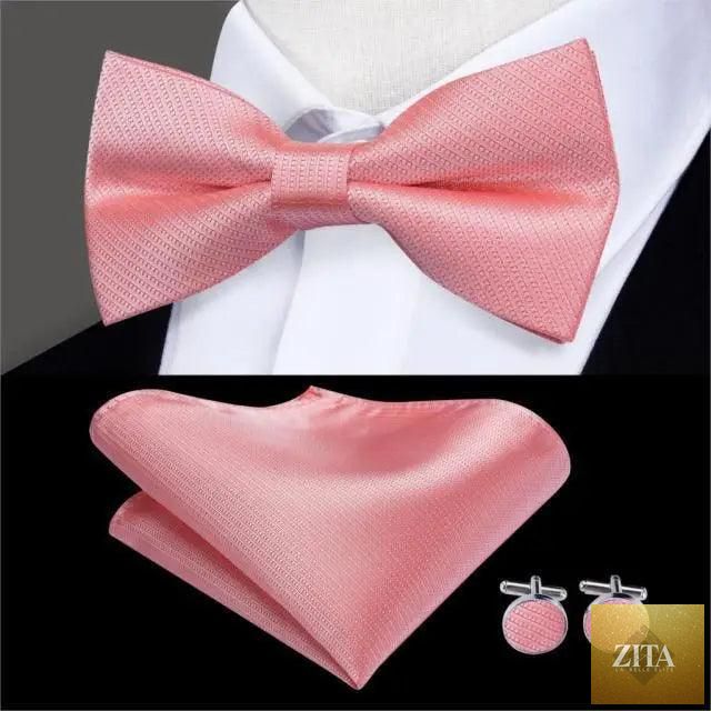Elegant green silk bow tie set with matching pocket square and cufflinks for men, ideal for weddings and formal events.