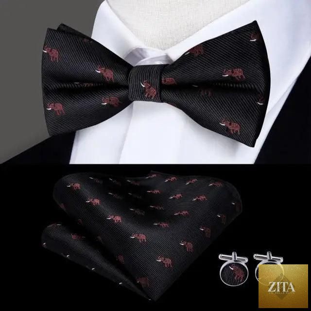 Elegant green silk bow tie with matching pocket square and cufflinks, perfect for weddings and formal events.
