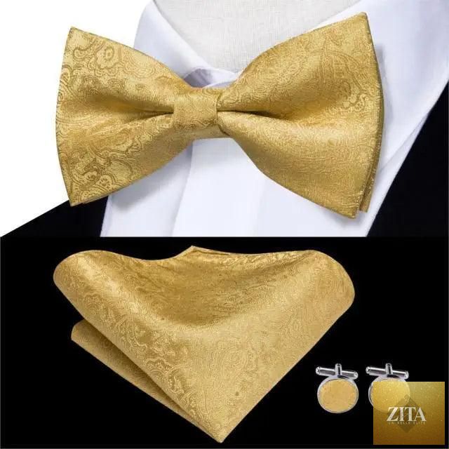 Elegant green silk butterfly bow tie with matching pocket square and cufflinks set for men, ideal for weddings and formal events.