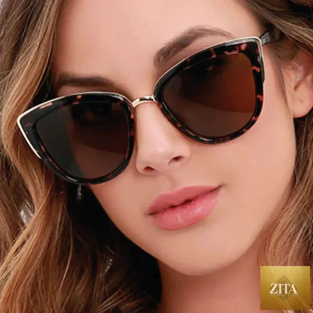 Mandotos Cleo Cat Eye Shades featuring bold black frames and tinted lenses, stylish eyewear for a fashionable look.