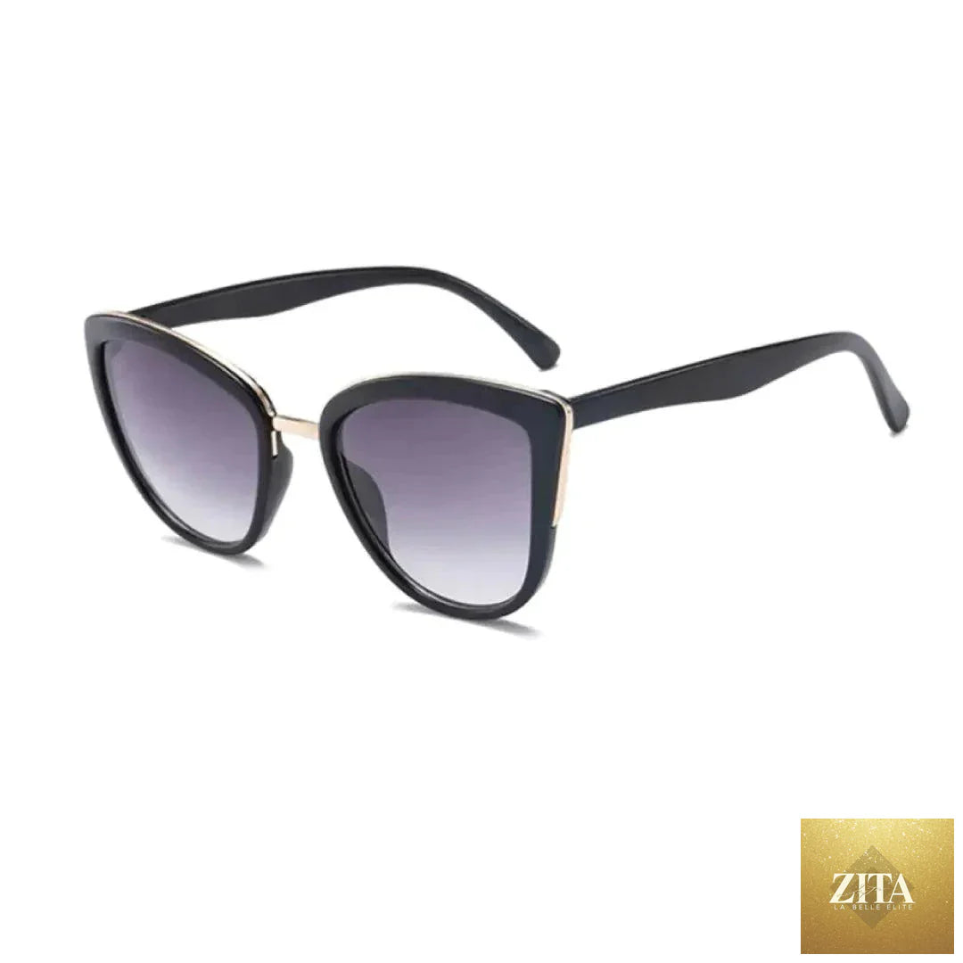 Mandotos Cleo cat eye shades with black frames and tinted lenses, stylish eyewear for a fashionable look.