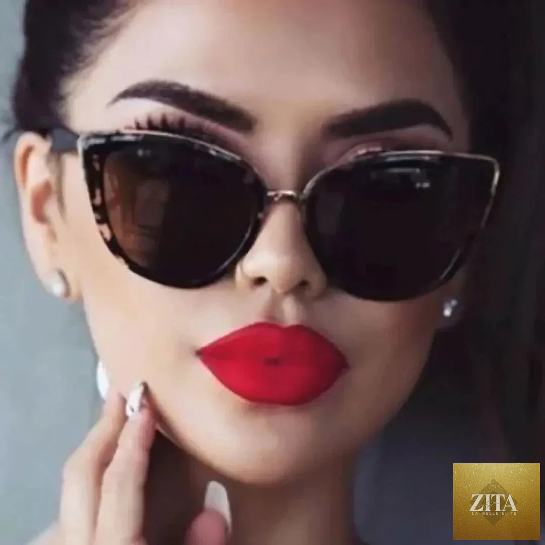 Mandotos Cleo Cat Eye Shades with black frames and tinted lenses, stylish eyewear for a chic, vintage-inspired look.