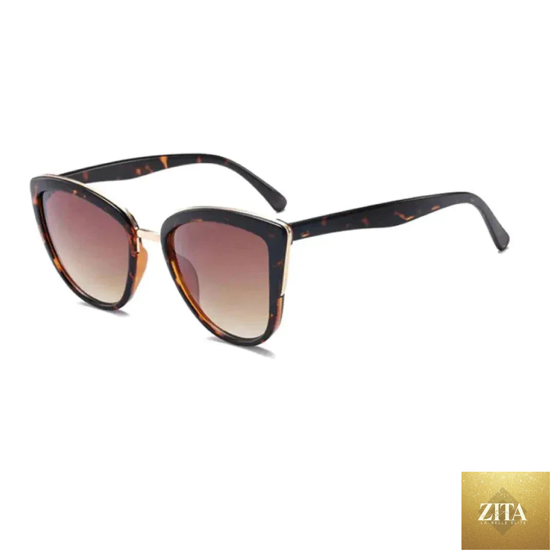 Mandotos Cleo Cat Eye Shades with black frames and tinted lenses, stylish eyewear for a chic, vintage-inspired look.