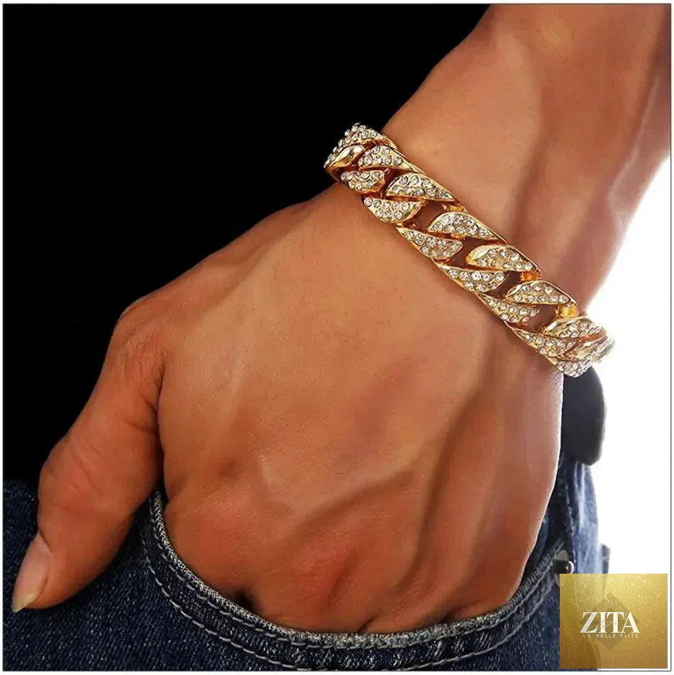 Mandotos Clyde Elegance Gold Bracelet featuring a sleek, polished gold design with intricate detailing on a white background.