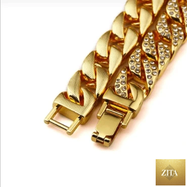 Mandotos Clyde Elegance Gold Bracelet featuring a sleek, polished gold design with intricate detailing on a plain background.