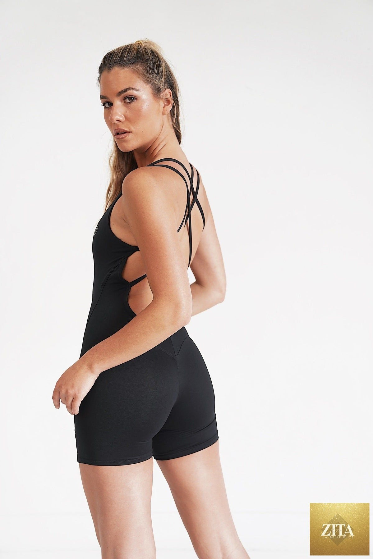 KIMITH BRAND black stretch bodysuit with "I Am Enough" print, designed as a comfortable, fitted pant for casual or stylish wear.