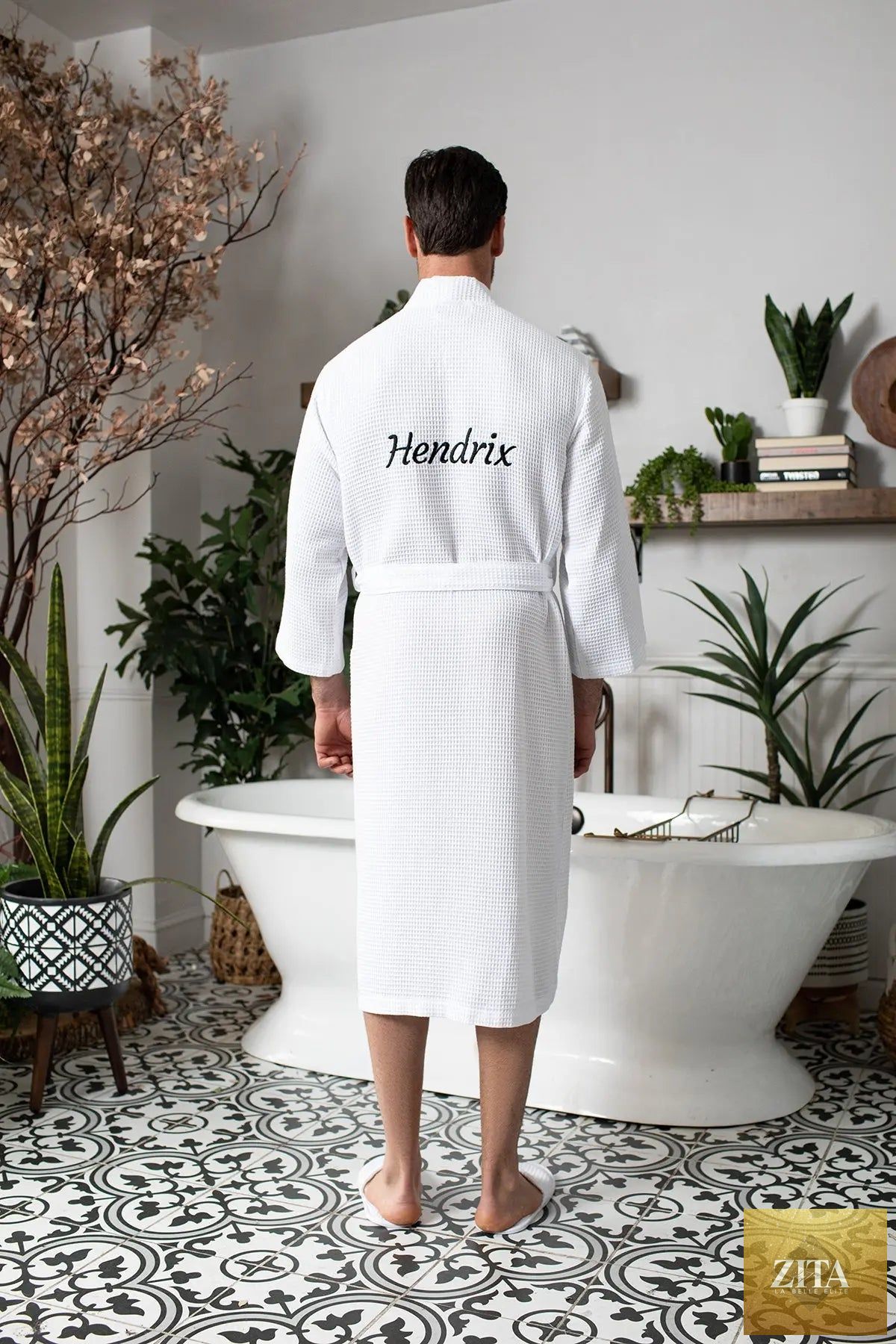Lotus Linen men's waffle spa bathrobe, lightweight and absorbent, shown hanging on a hook with a relaxed fit and textured fabric.