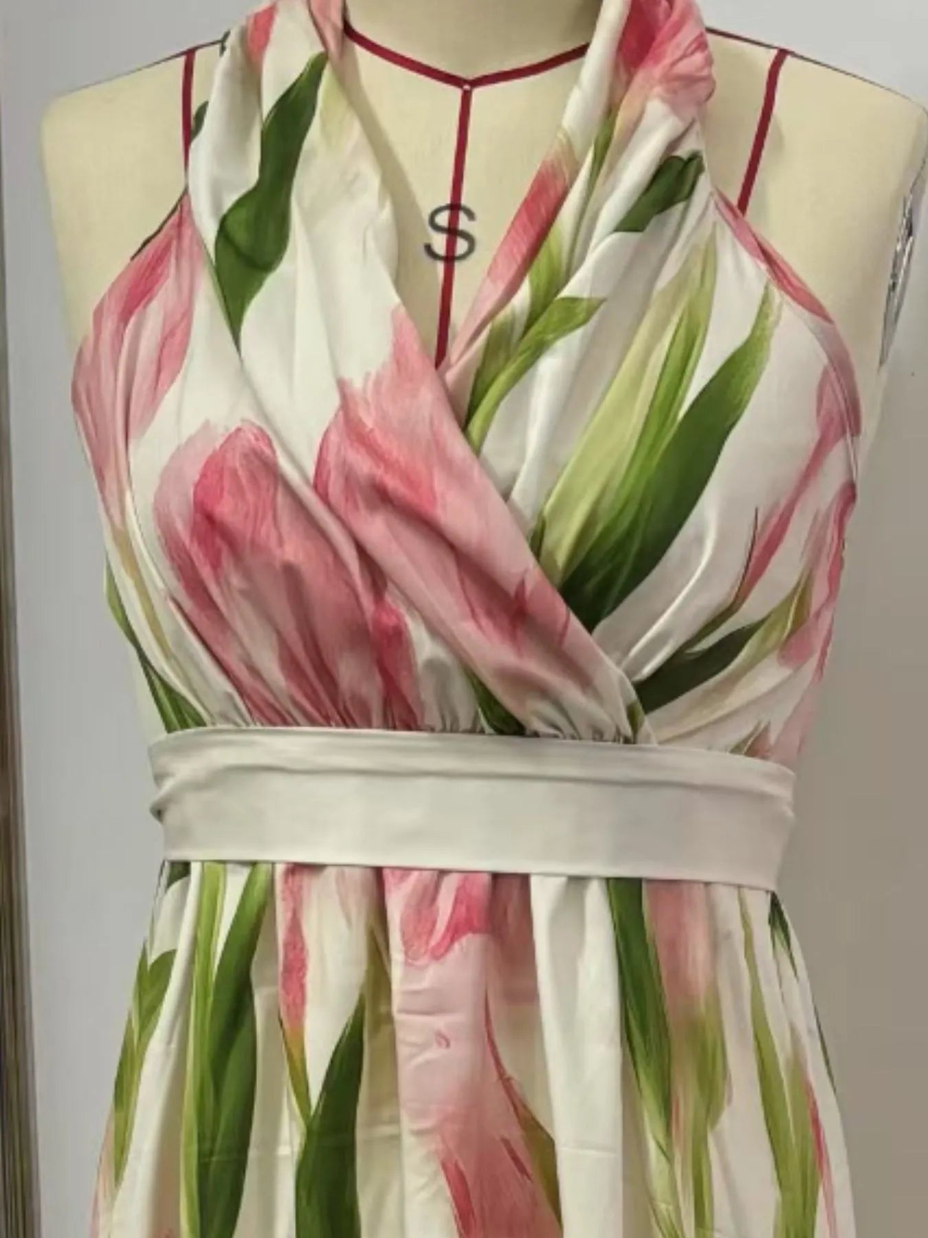 Floral print halter neck maxi dress by Shopiebay featuring a flowing silhouette and vibrant floral pattern.